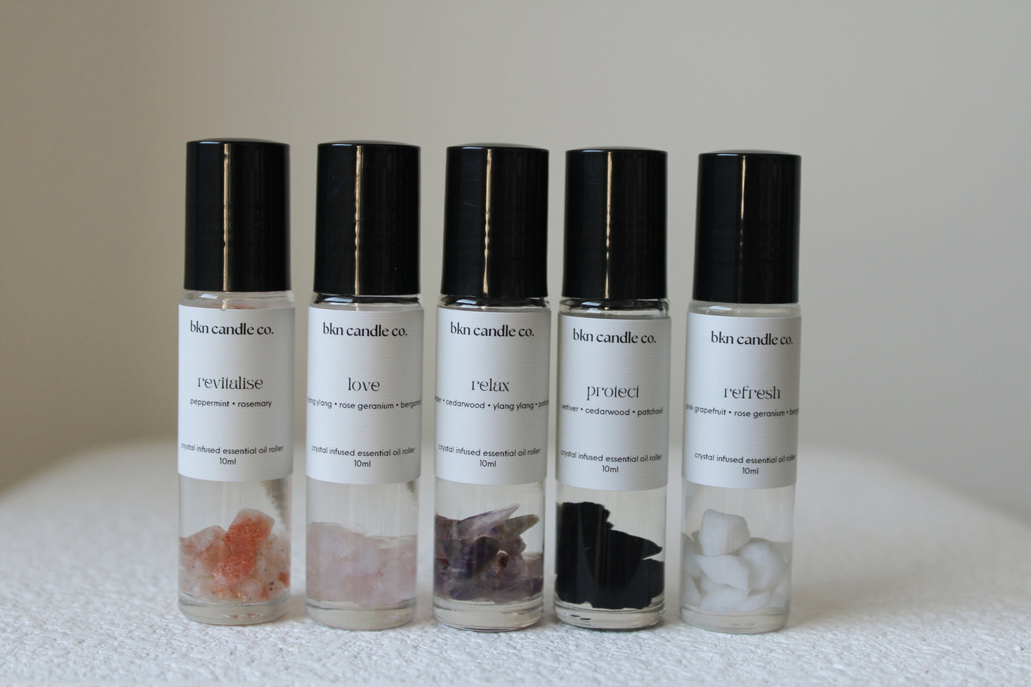 crystal-infused essential oil rollers.